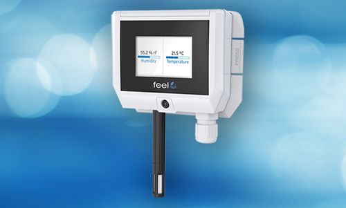 Feel FHT der FSM AG mit Display und integriertem Fühler, abgebildet vor einem blauen Hintergrund.